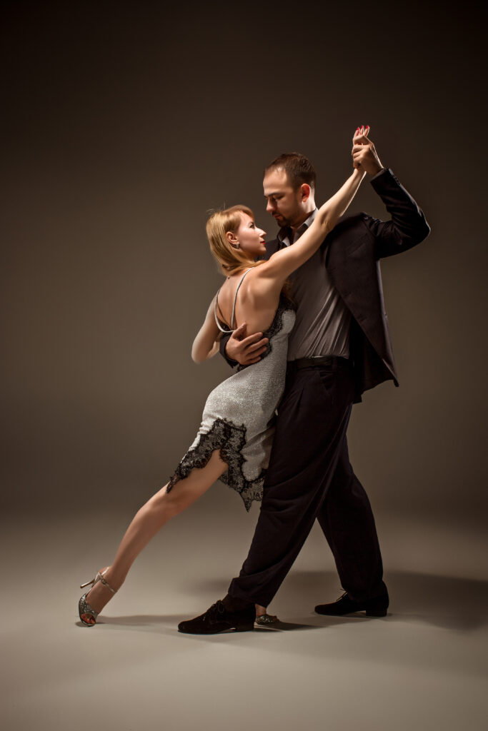 Couple dancing ballroom at a private dance lesson for adults.