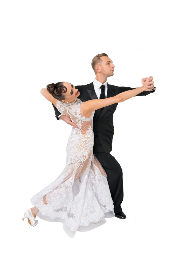 Ballroom dance couple performing classic closed-hold Waltz in Standard style