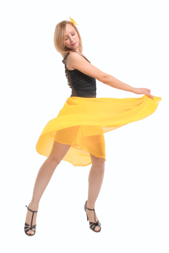 Cuban motion in cha-cha dance demonstrated during Latin class for adults