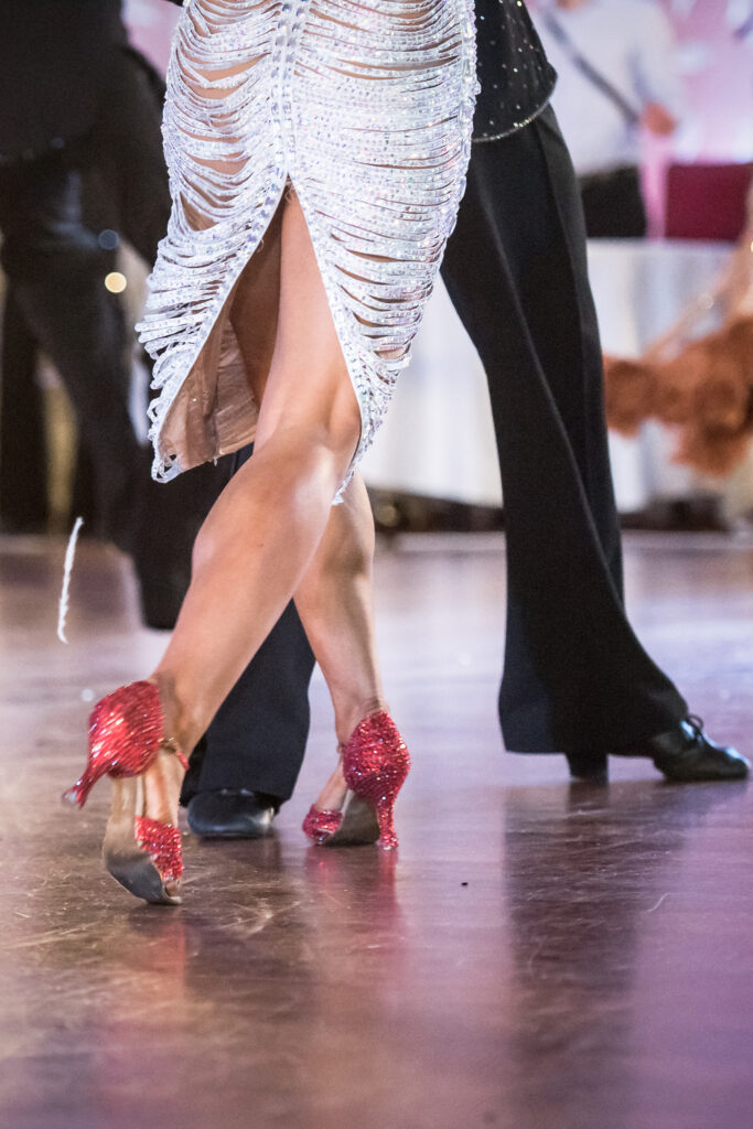 Certified Latin dance instructor demonstrating Rumba footwork in Livingston studio