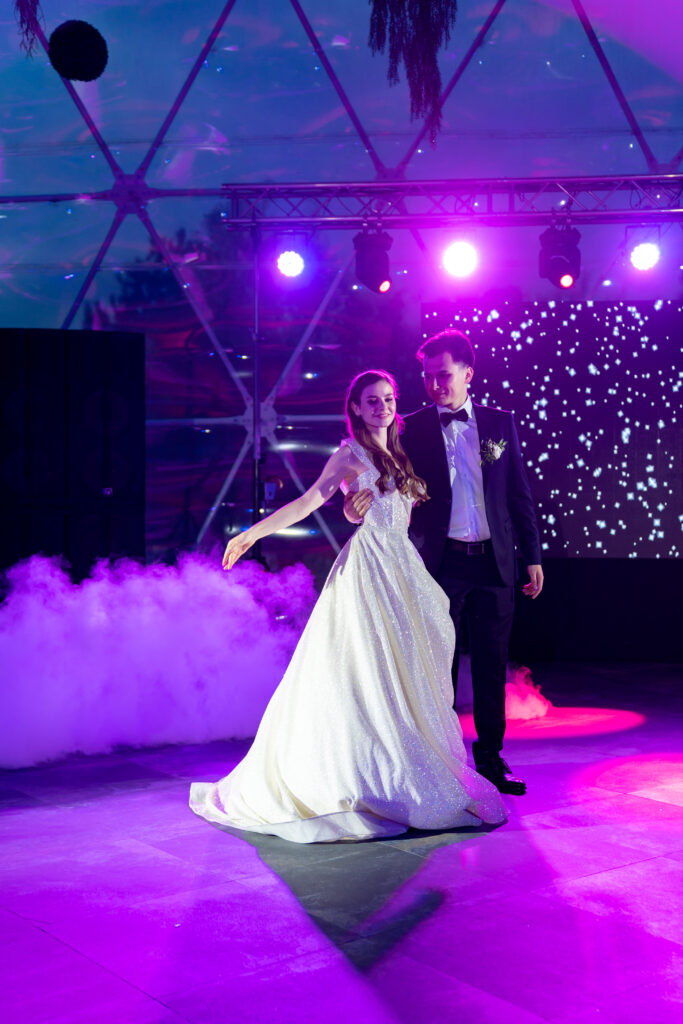 Wedding couple sharing a romantic first dance under soft lighting